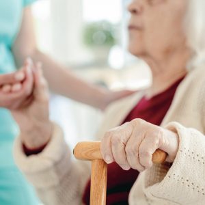 Sage Oak of Denton | Senior woman holding hands with caregiver